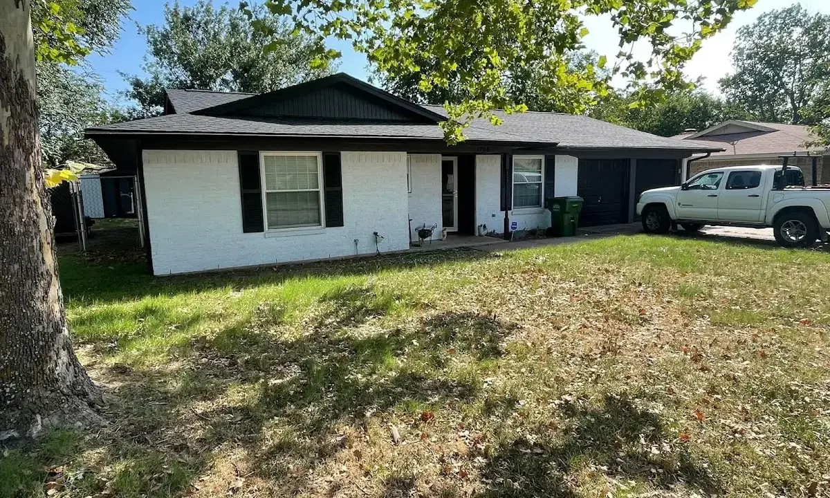 Professional roofing crew working on a residential roof in Little Ferry